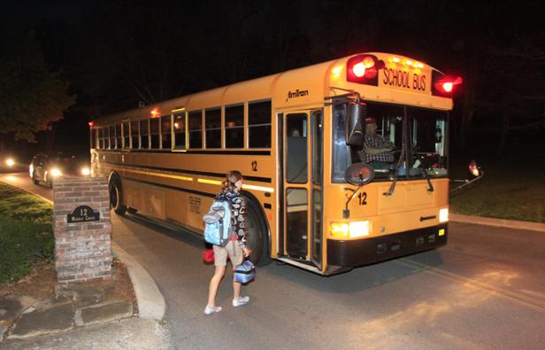 Signal Mountain Middle School sixth-grader Damaris Kleine prepares to board a school bus at 6:45 a.m. Thursday. Mary A. Carskadon has found a correlation between insufficient sleep in adolescents and health issues due to early school start times. She spoke at UTC on Thursday.